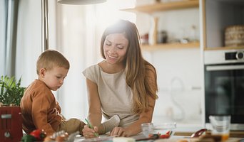 Image of adult instructing toddler