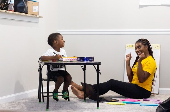 Image of teacher teaching toddler