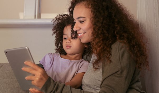 Girl and Mom on IPad