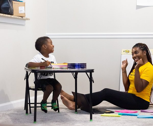 Image of teacher teaching toddler